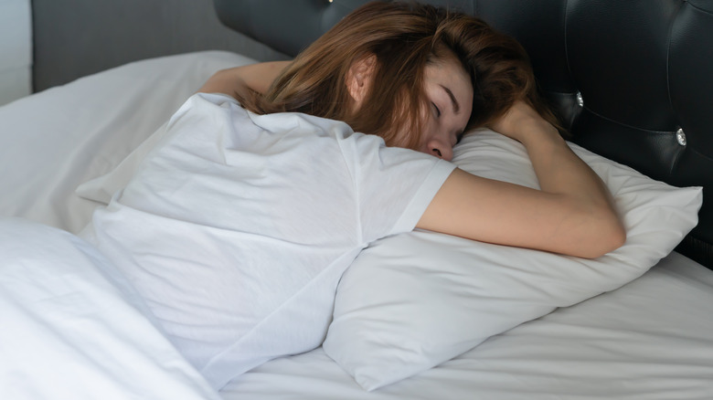 woman sleeping on stomach