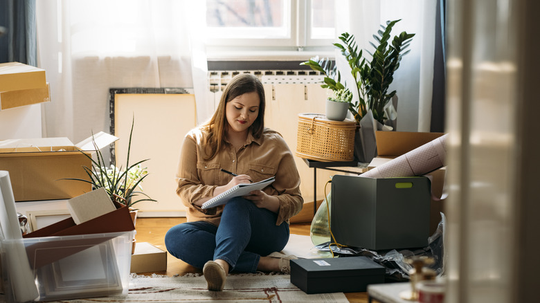 woman writing in notebook