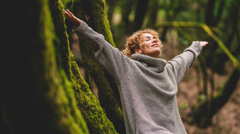 Free-spirited woman in forest 