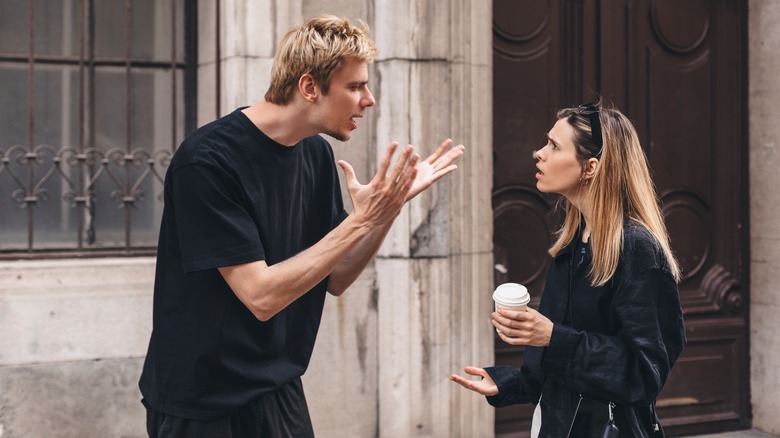 Couple arguing on the street 