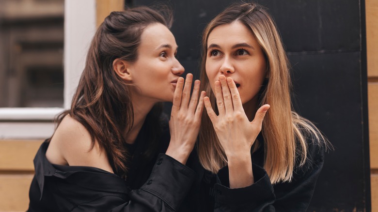 Two friends gossiping 