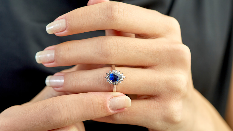 woman wearing sapphire ring