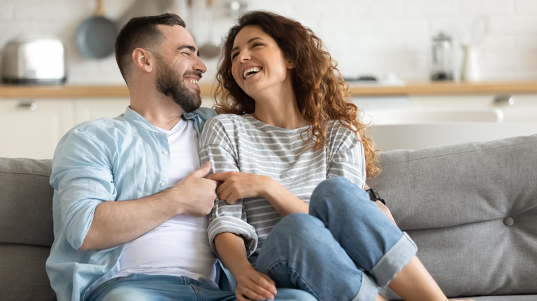 happy couple on couch