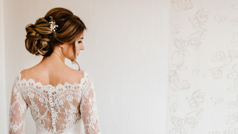 Stylish bride in lace dress