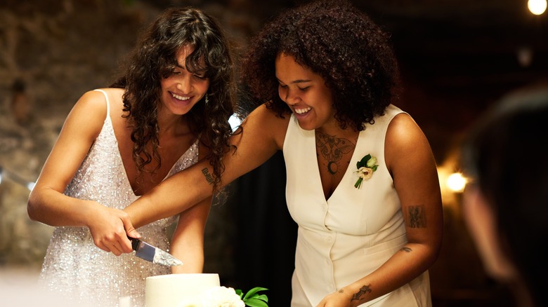 couple cutting cake