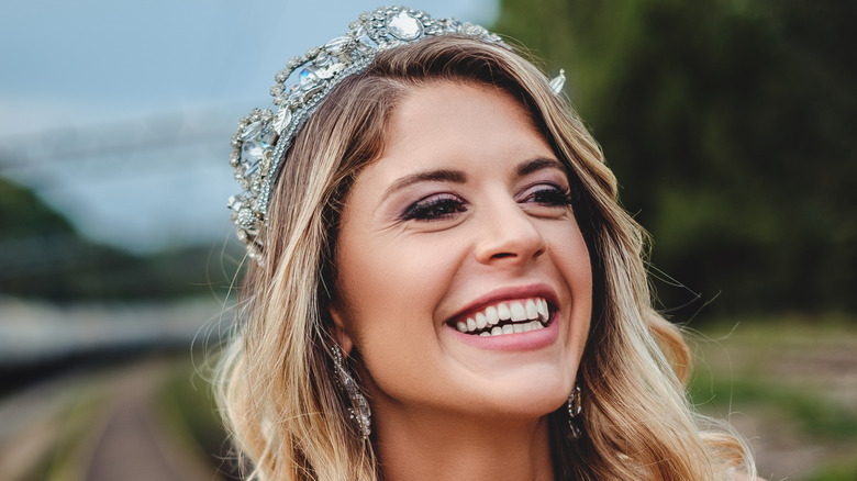 smiling woman wearing tiara