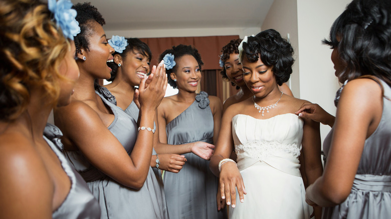 smiling bride with bridesmaids 