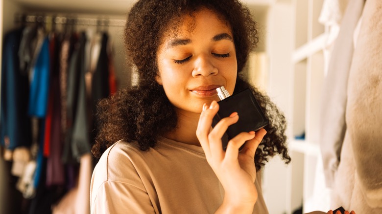 woman smelling perfume