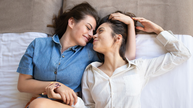 smiling couple on bed