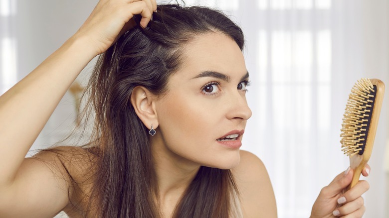 woman combs hair