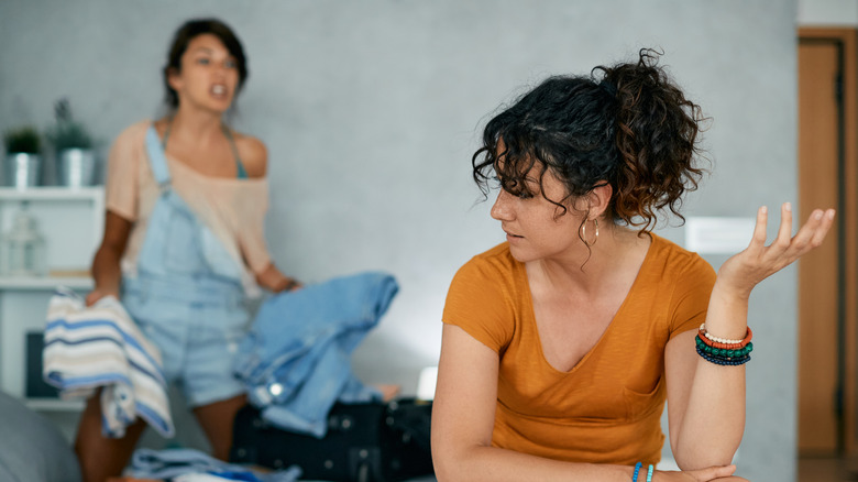 Lesbian couple arguing in bedroom