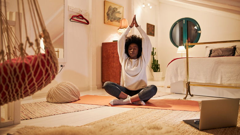 woman doing yoga at home